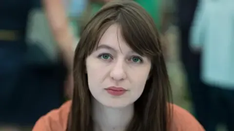 Irish author Sally Rooney claims she is unable to enter the UK over legal concerns